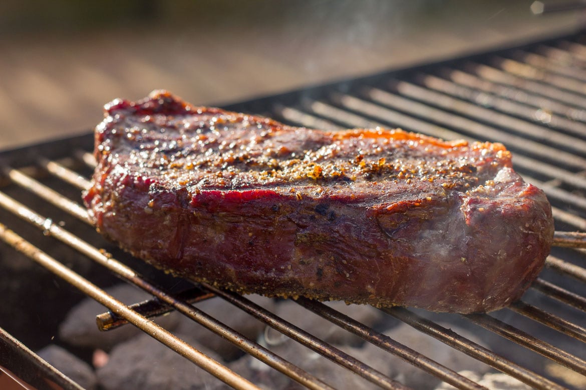 New York Strip Steak Seared Over Fire